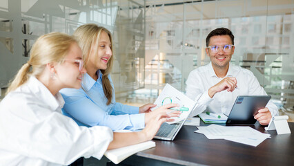 Team members work together in a modern office setting