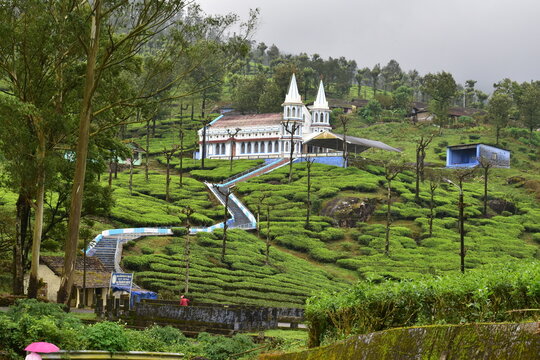Hilltop Karumalai Velankanni Church nestled in vibrant tea gardens of Valparai, Tamil Nadu, highlighting calm spirituality and scenic travel destination