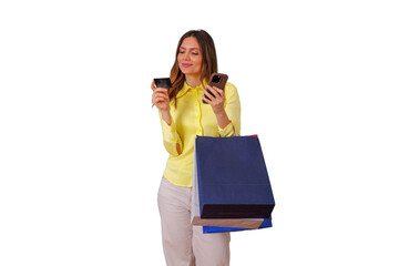 Woman holding shopping bags, credit card and smartphone, making online payment for e-commerce purchases