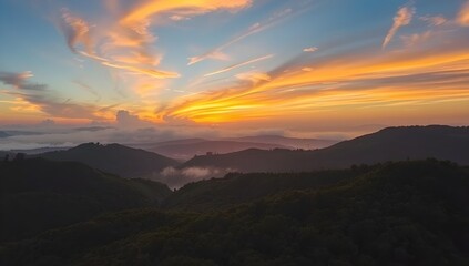 Aerial View of Colorful Sunrise Over Misty Mountain Forest. Scenic Nature Landscape
