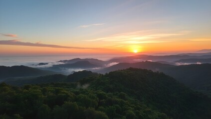 Aerial View of Colorful Sunrise Over Misty Mountain Forest. Scenic Nature Landscape