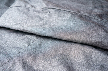 Naklejka premium Gray fabric for creating trousers and business clothes