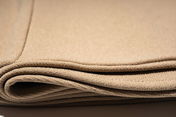 Close-up of cream ribbed cotton fabric