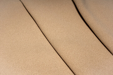 Close-up of cream ribbed cotton fabric