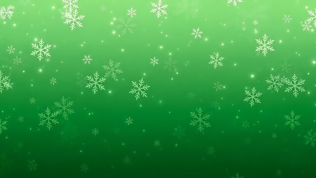 Delicate snowflakes falling against green background