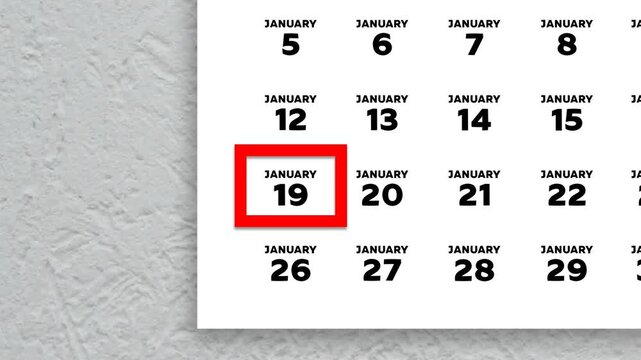 The date January 19th marked with a red cursor on the wall calendar 2026
