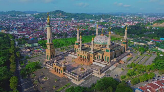 a 4k footage aerial view of islamic center or baitul muttaqien mosque in samarinda with blue sky