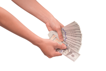 Hand holding stack of hundred US dollar bills, isolated on transparent PNG. Studio shot for finance and currency exchange concepts.