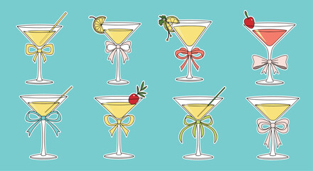 Assorted martini cocktail glasses decorated with colorful ribbons, garnishes, and straws set against a vibrant turquoise background.