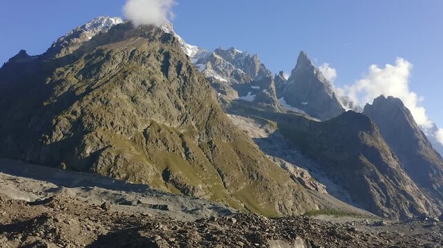 A breathtaking panorama of the high alpine peaks and glaciers within Mount Cook National Park New Zealand showcases a snowy mountain range and rocky valley under a clear sky