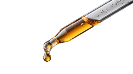Dropper dispensing golden liquid oil, serum or cosmetic product drop, pipette creating a falling essential fluid
