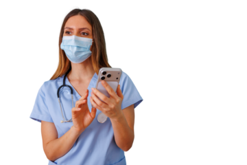 Medical professional wearing scrubs and face mask, holding and using a smartphone on a transparent background for telehealth services