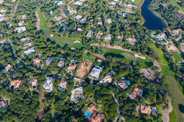 Exclusive Luxury Real Estate at San Lorenzo Golf Course: 4K Aerial View of Palatial Mansions, Private Infinity Pools, and Championship Fairways in Quinta do Lago, Algarve, Portugal