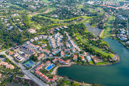 Exclusive Luxury Real Estate at San Lorenzo Golf Course: 4K Aerial View of Palatial Mansions, Private Infinity Pools, and Championship Fairways in Quinta do Lago, Algarve, Portugal