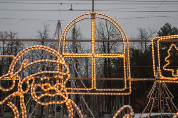 Festive Christmas Light Decoration with Santa and Gift on City Street