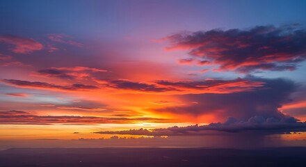 Fototapeta premium Vivid sunset paints the sky with vibrant orange, pink, and purple hues.