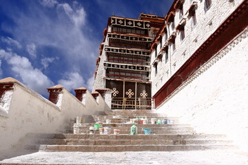 Potala Palace, Lhasa, Tibet, China: equipment for the renovation work at the Palace, white paint used by local workers, residents and volunteers
