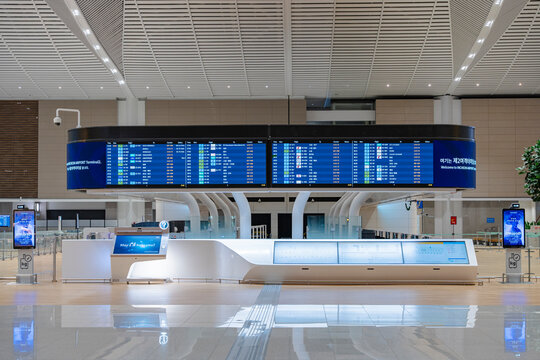 December 27, 2025, Incheon, South Korea - Flight information display boards in a deserted hall of Incheon International Airport Terminal 2.