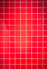 Red tile wall background with clean geometric pattern. Ceramic surface design suitable for interior, bathroom, kitchen, architecture, and decorative concepts.