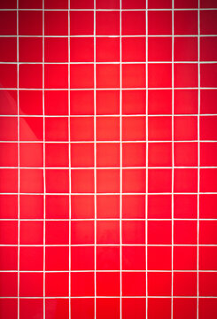 Red tile wall background with clean geometric pattern. Ceramic surface design suitable for interior, bathroom, kitchen, architecture, and decorative concepts.