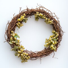 A circular wreath made of twigs adorned with small green berries. The design is simple and natural, suitable for home decor or seasonal decoration.