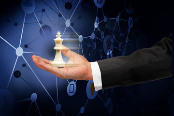 Use the best opting to the decision making on virtual media concept, Business man hand holding king chess on dark digital diagram background