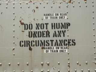 A sign stenciled onto a train car
