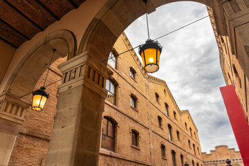 Monumental buildings with brick arches in the portside neighbourhood of Barcelona, Catalonia.