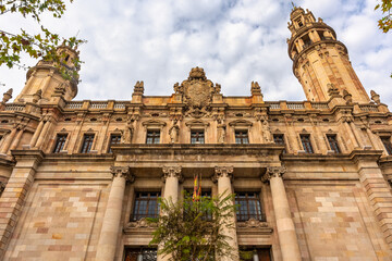 Huge neoclassical buildings in the city of Barcelona with impressive architecture, Catalonia.