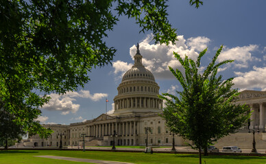Washington DC Capitol building. Congress on Capitol Hill. American flag over Capitol. Historic USA...