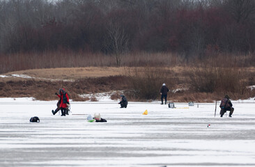people walking on a frozen lake