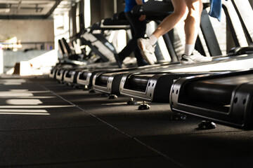 Treadmill Rows with Man Running Legs Close Up