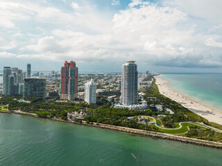 Obraz premium Top view of South Miami Beach. Scenic drone view of Miamis famous coastline. Miami Beach skyline with skyscrapers. Aerial view of Miami Beach in summer. Miami Beach shore with skyscrapers.