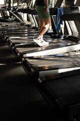 Treadmill Rows with Man Running Legs Close Up