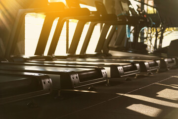Sunset Backlit Treadmills in Gym Photo