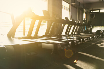 Sunset Backlit Treadmills in Gym Photo
