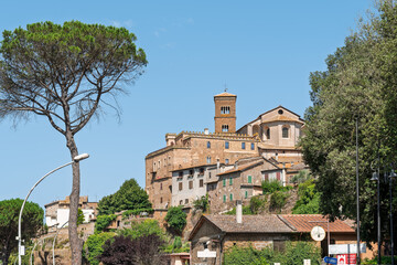 Italy - Sutri - Historic hilltop town - Stone houses, bell tower and pine tree on the Etruscan cliff above the valley