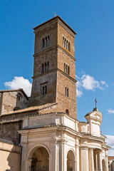 Italy - Sutri - Santa Maria Assunta Cathedral - Romanesque bell tower with Renaissance porch under blue sky