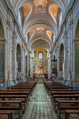 Italy - Sutri - Santa Maria Assunta Cathedral - Central nave with coffered vaults, frescoes and aligned wooden pews