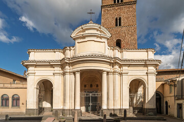 Italy - Sutri - Santa Maria Assunta Cathedral - Renaissance facade with portico and Romanesque tower in afternoon light © Guillaume