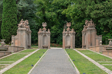 Fototapeta premium Italy - Caprarola - Palazzo Farnese - Path in the formal Renaissance gardens with stone herm statues and cypress trees
