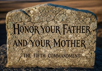 The Fifth Commandment Carved Into The Stone In A Stylized Font For Family Respect