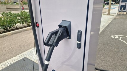 Electric vehicle charging station providing sustainable energy