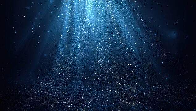 Abstract underwater scene with light rays and particles on a dark blue background