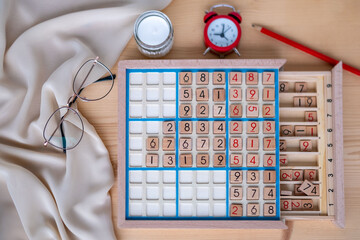 Wooden sudoku board representing intellectual engagement and mental fitness. A timeless tool for sharpening focus, cognitive health, mental wellness