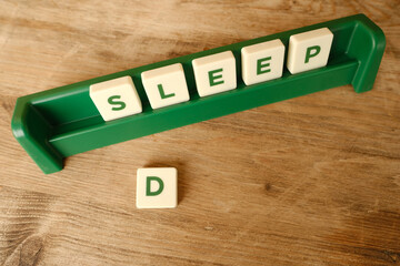 close-up collecting words sleep on table made of letters, concept mental health, illustrating the connection between restful sleep and overall well-being