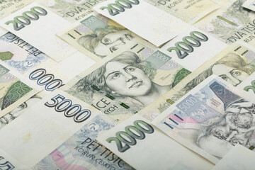Obraz premium An overhead shot reveals a detailed display of Czech Koruna banknotes, featuring the 2000 and 5000 denominations, creating visual representation of Czech currency, Czech Republic.