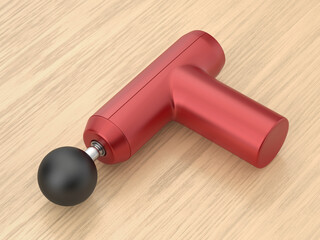 Red massage gun on wooden desk