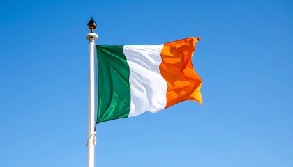 Vibrant Irish Flag Waving Against Clear Blue Sky on Sunny Day