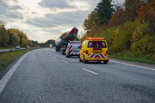 Heavy transport convoy with escort cars and long special load